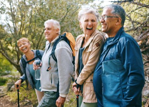 A group of people sitting on a bench.