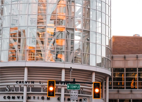 A traffic light sits in front The Salt Palace
