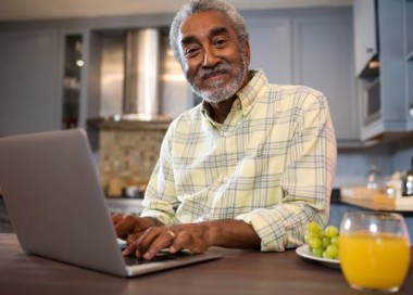 A man working on his laptop.