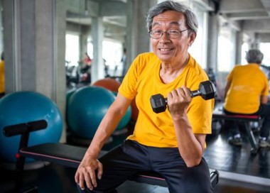 A person sitting in a gym.