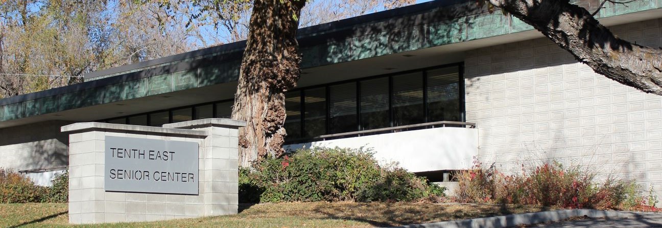 A building with a sign in front.