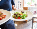 A bowl of salad on a table.