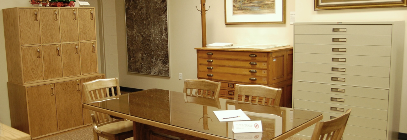 A room with a table and chairs.