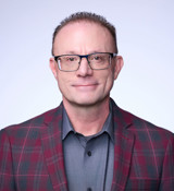 A man wearing glasses.