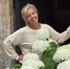 A woman holding a bouquet of flowers.
