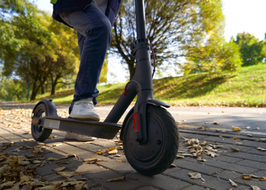 A person riding a scooter.