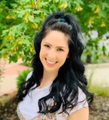 A person smiling for the camera.