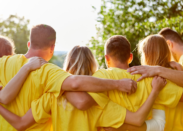 A group of people in yellow shirts.