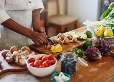 A person cutting vegetables.