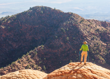 A person standing on a rock.