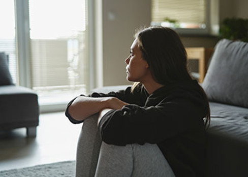 A person sitting on a couch.